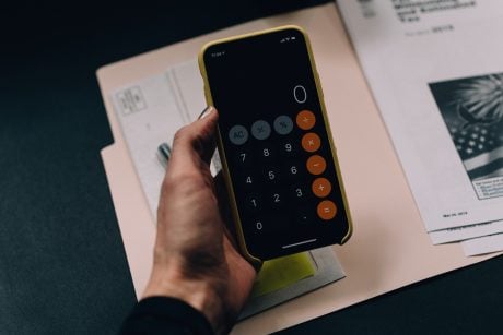image of a baddie using a calculator app